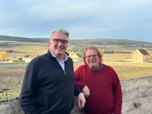 Manoël Bouchet, left, and Erni Loosen stand on the back terrace of Vieux Château de Puligny-Montrachet, their new Burgundy headquarters. (Courtesy Perron de Mypont)